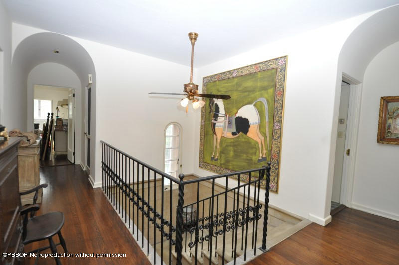 245 Valencia Road West Palm Beach, FL 33401 - Photo 14 of 19 a view of a hallway view with wooden floor and windows