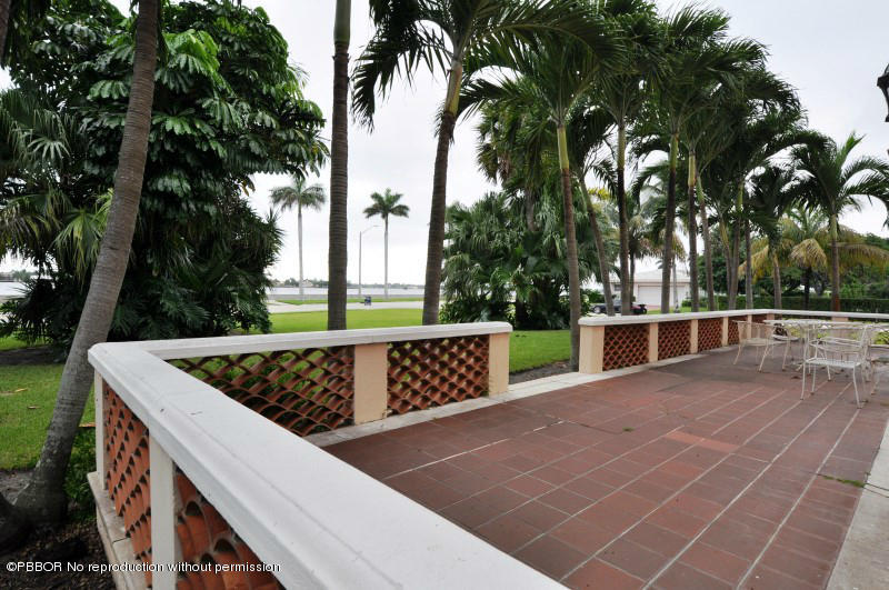 245 Valencia Road West Palm Beach, FL 33401 - Photo 15 of 19 a view of outdoor space with seating and trees