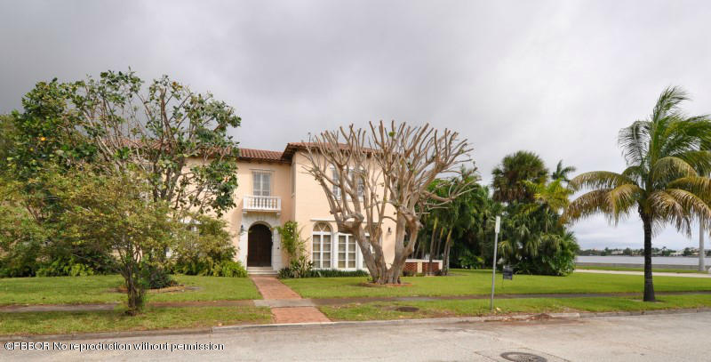 245 Valencia Road West Palm Beach, FL 33401 - Photo 18 of 19 a front view of a house with a garden