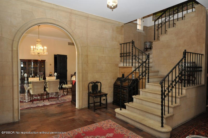245 Valencia Road West Palm Beach, FL 33401 - Photo 5 of 19 a view of entryway and hall with wooden floor