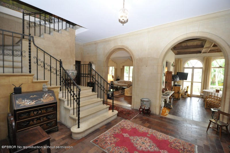 245 Valencia Road West Palm Beach, FL 33401 - Photo 6 of 19 a view of entryway and hall with wooden floor