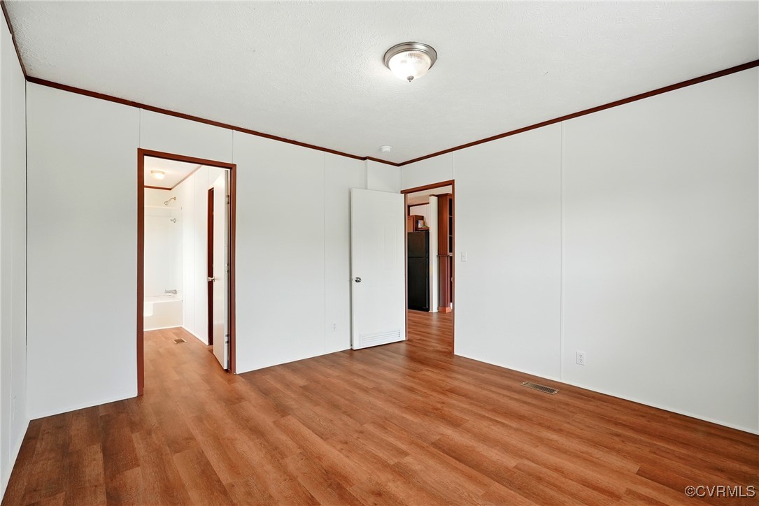 141 Sheppards Drive Farmville, VA 23901 - Photo 13 of 31 a view of an empty room with wooden floor