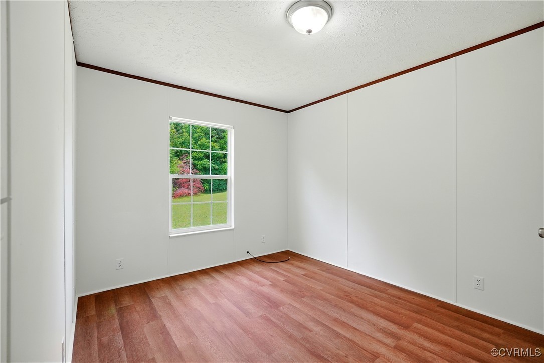 141 Sheppards Drive Farmville, VA 23901 - Photo 18 of 31 an empty room with wooden floor and windows