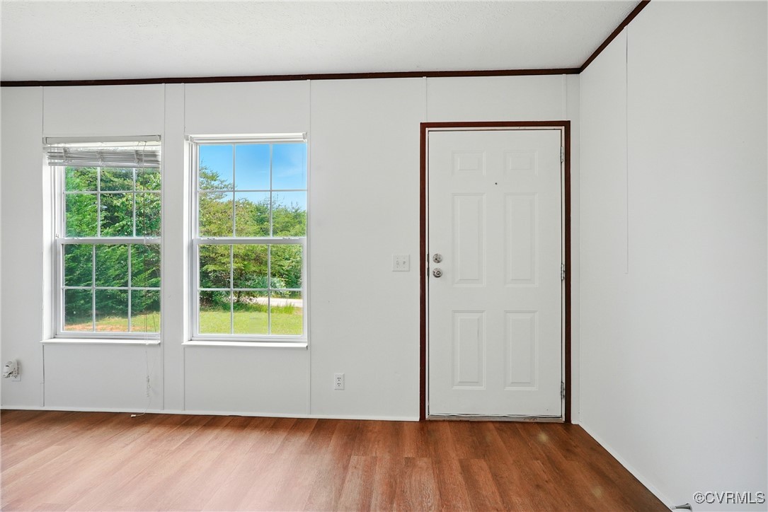 141 Sheppards Drive Farmville, VA 23901 - Photo 3 of 31 an empty room with wooden floor and windows