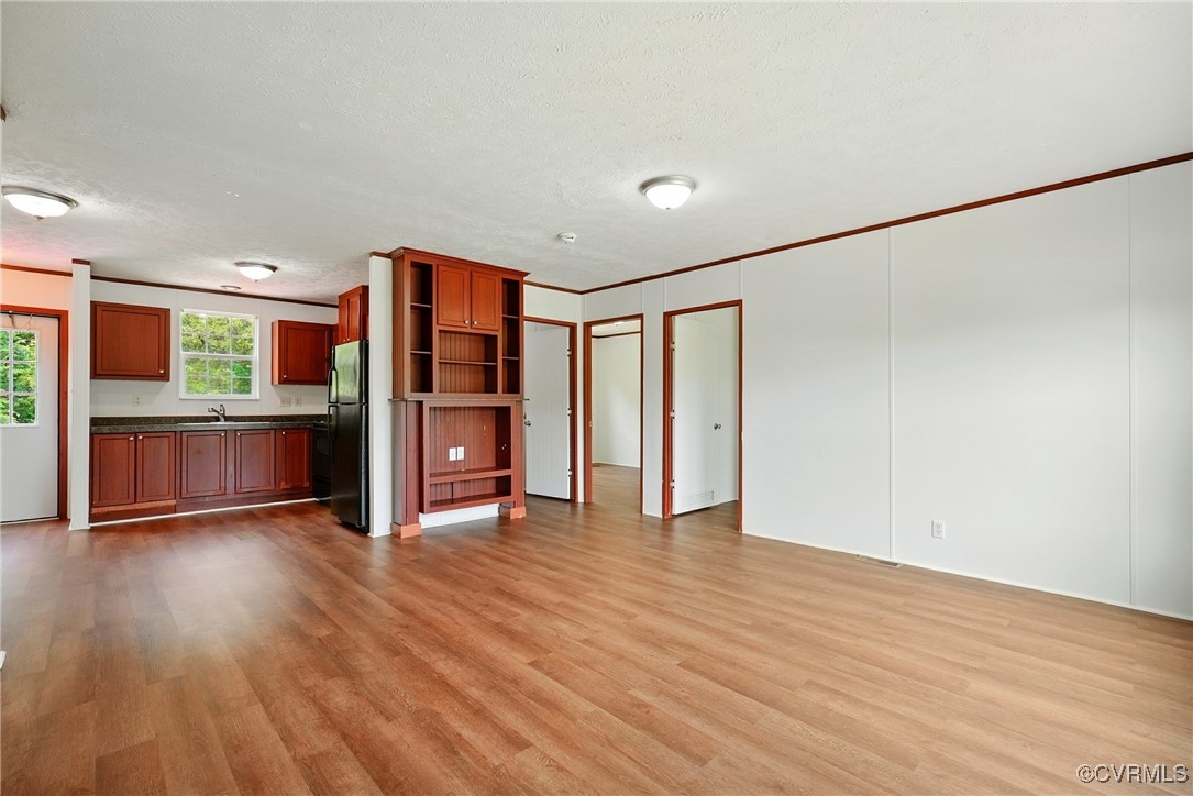 141 Sheppards Drive Farmville, VA 23901 - Photo 4 of 31 an empty room with wooden floor and windows