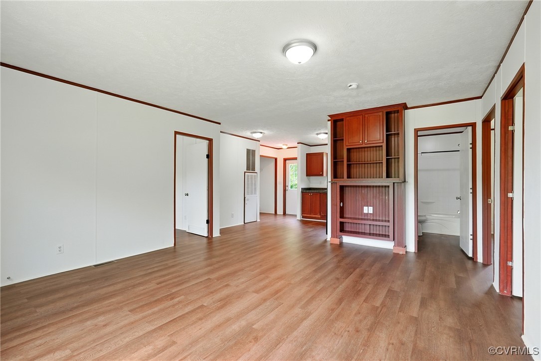 141 Sheppards Drive Farmville, VA 23901 - Photo 5 of 31 an empty room with wooden floor and closet