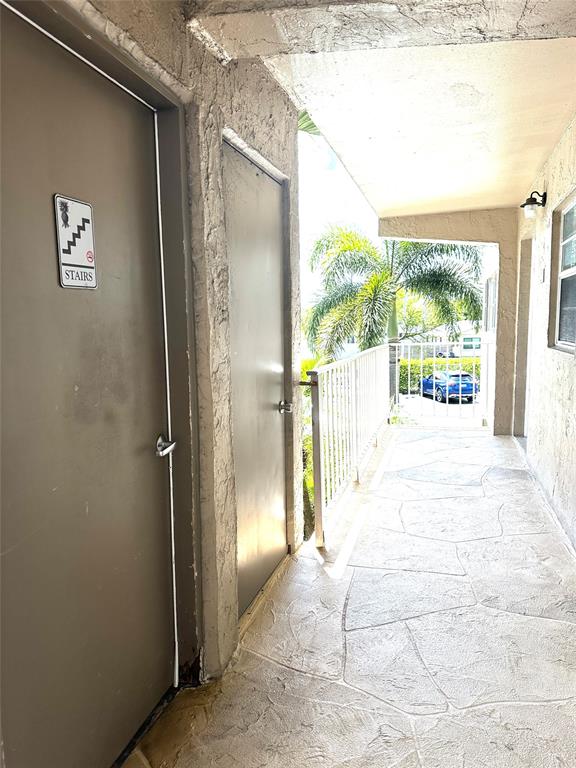 2300 Northeast 1st Lane, Unit 201 Boynton Beach, FL 33435 - Photo 18 of 34 a view of entryway with a floor to ceiling window