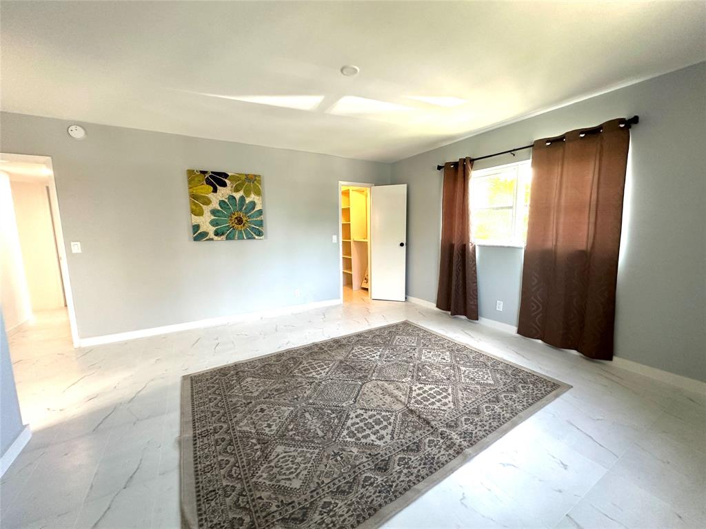 2300 Northeast 1st Lane, Unit 201 Boynton Beach, FL 33435 - Photo 9 of 34 a view of entryway with wooden floor