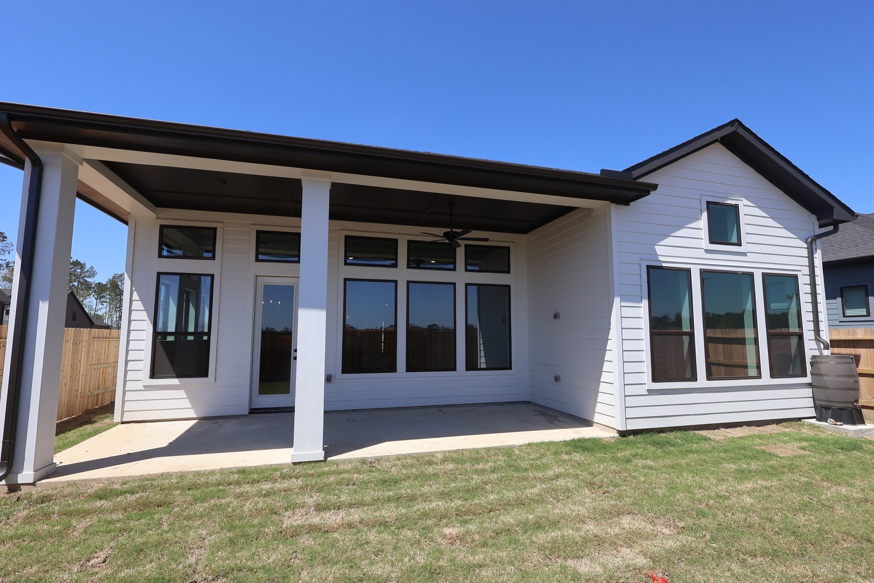18607 Rumba Court Conroe, TX 77302 - Photo 2 of 20 a view of a house with a large window and plants