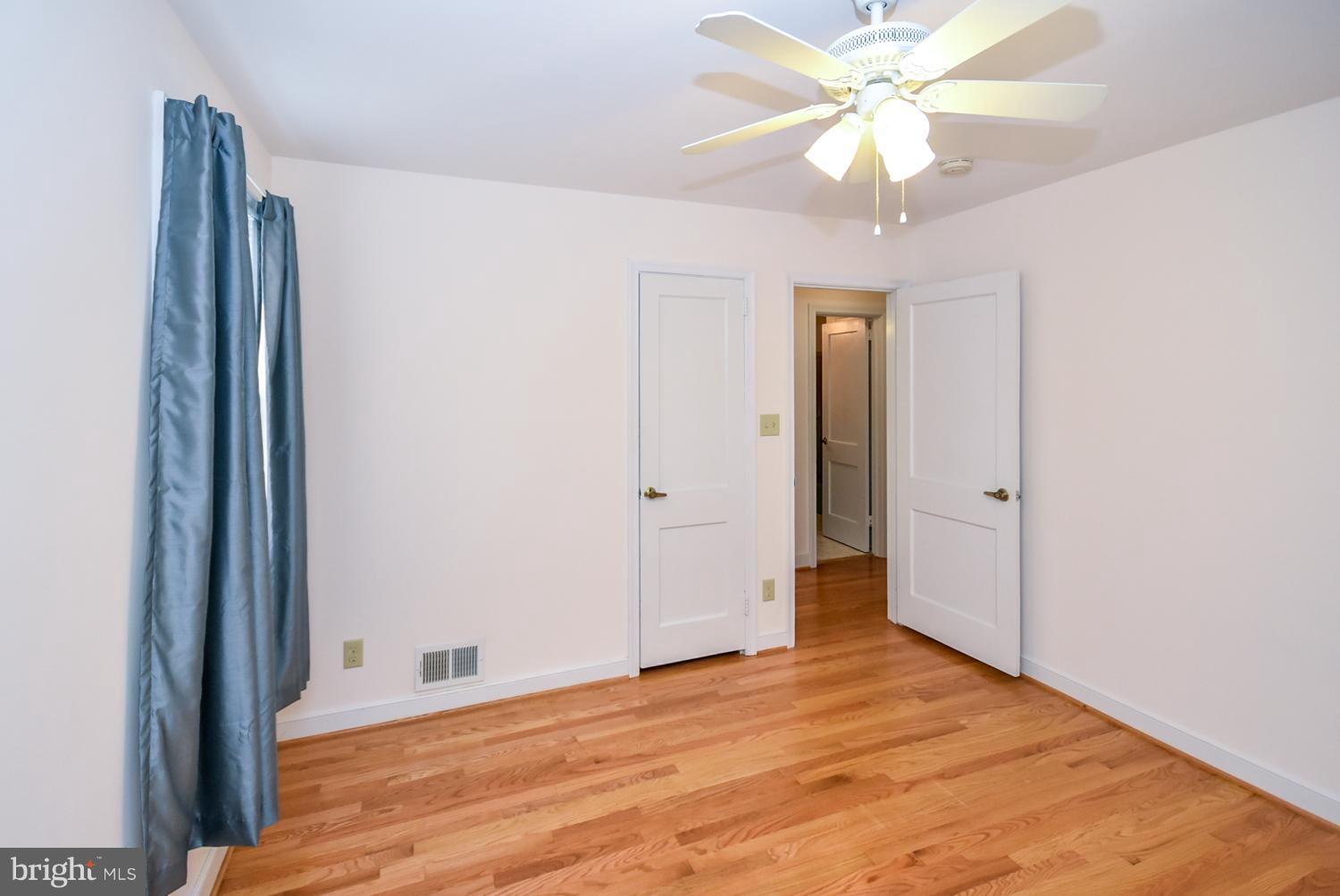 12311 Judson Road Silver Spring, MD 20906 - Photo 12 of 29 a view of an empty room with a chandelier fan