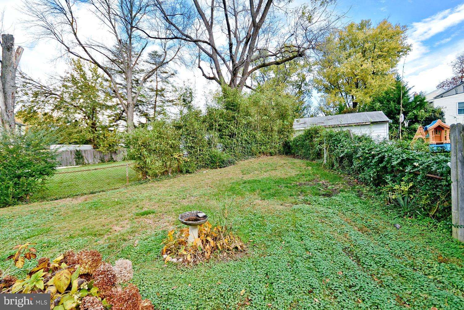 12311 Judson Road Silver Spring, MD 20906 - Photo 29 of 29 a backyard of a house with lots of green space
