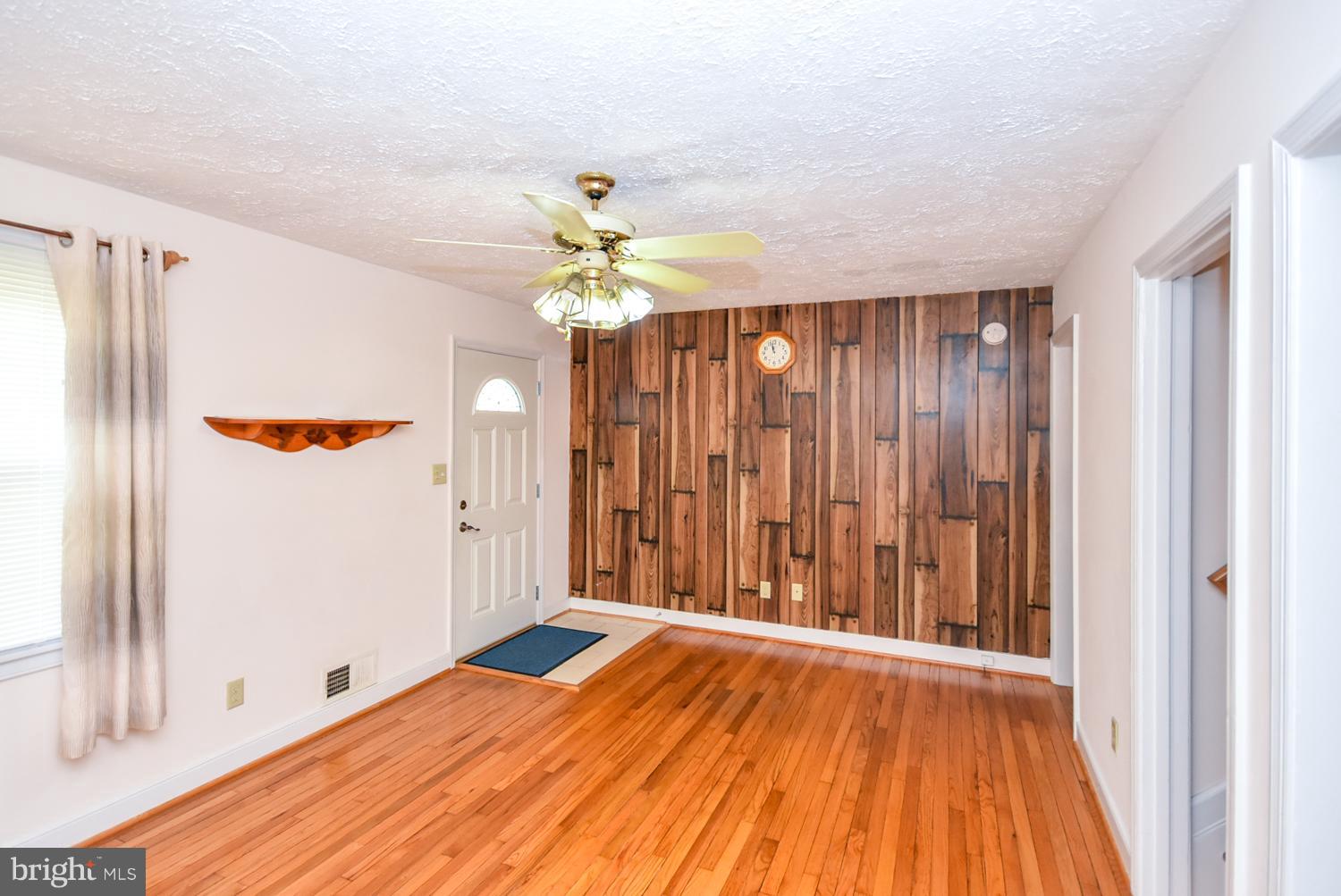 12311 Judson Road Silver Spring, MD 20906 - Photo 3 of 29 wooden floor in an empty room with a window