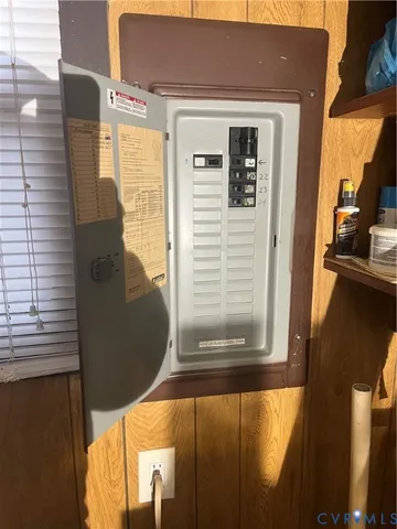 a room with furniture a flat screen tv and a window