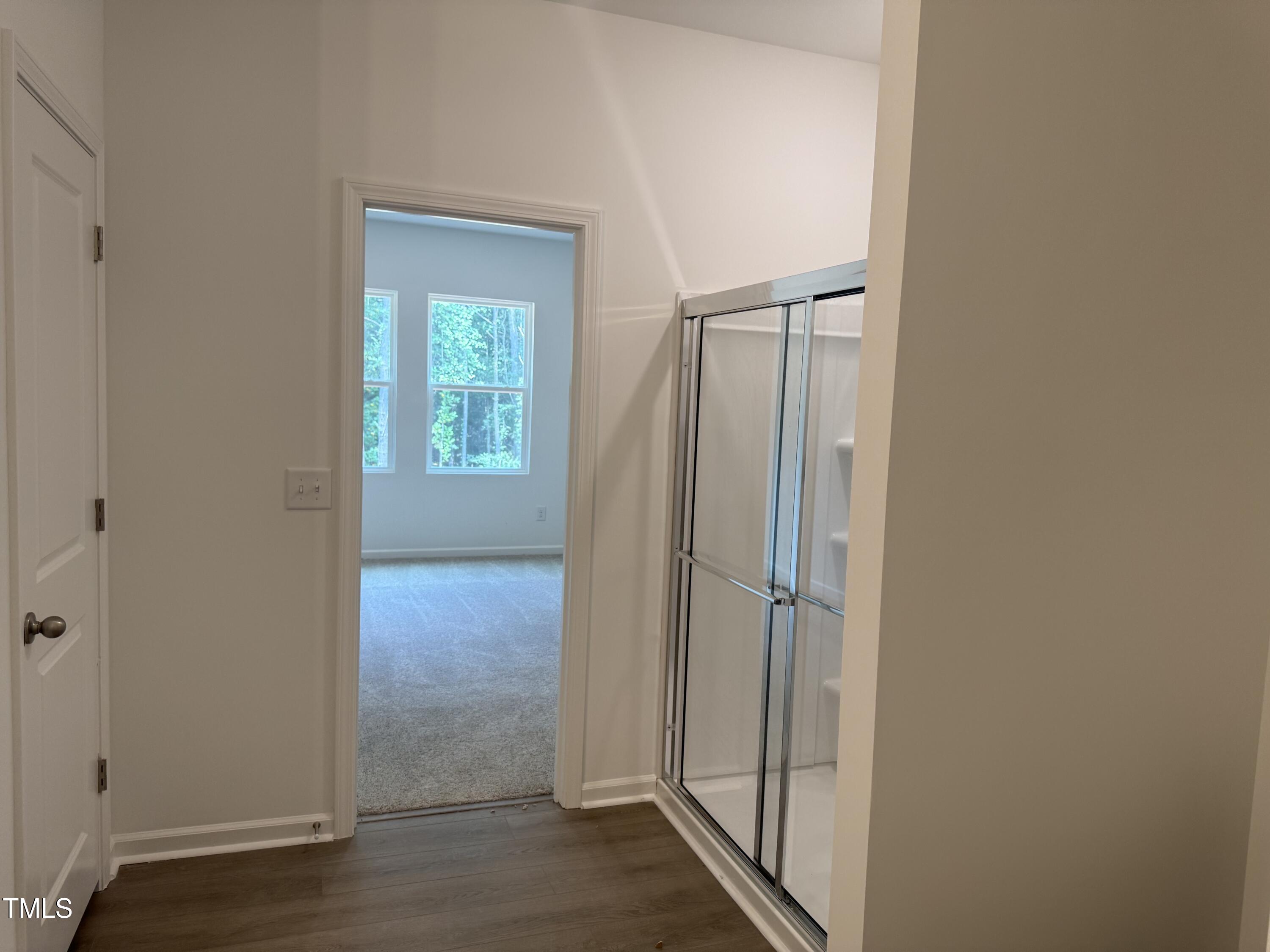 11185 Salers Loop Middlesex, NC 27557 - Photo 12 of 41 an empty room with wooden floor and a window
