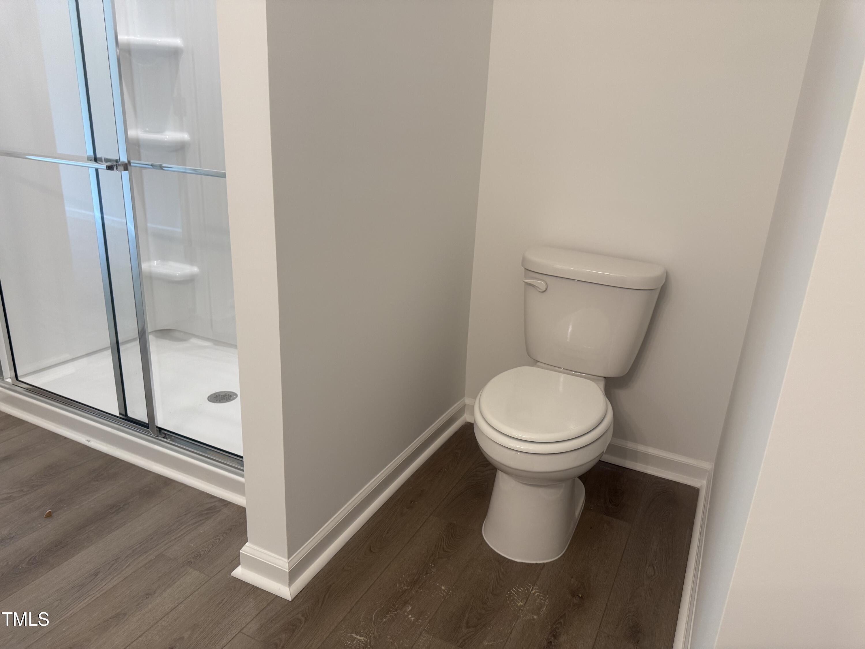 11185 Salers Loop Middlesex, NC 27557 - Photo 13 of 41 a white toilet sitting next to a shower