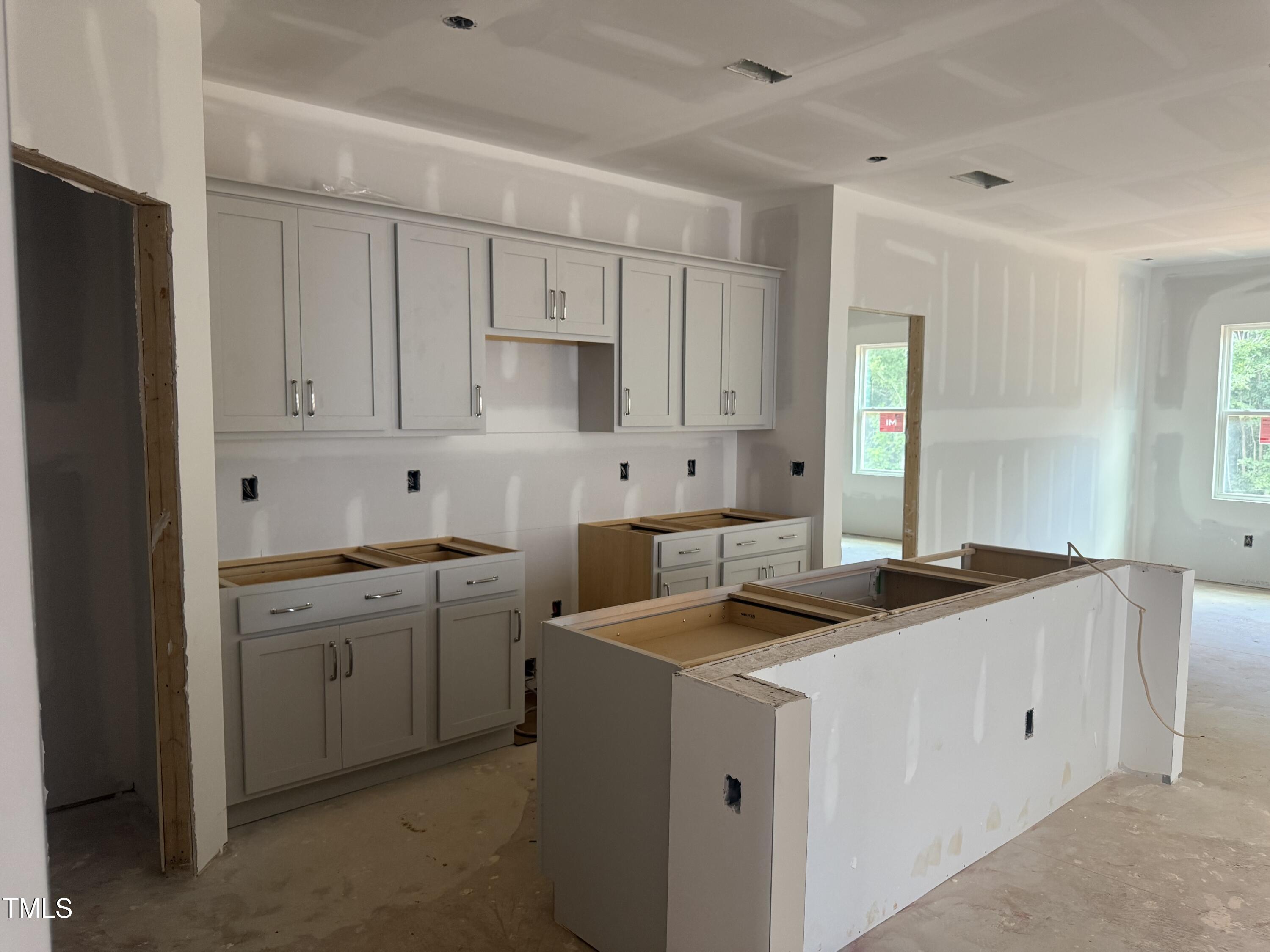 11185 Salers Loop Middlesex, NC 27557 - Photo 15 of 41 a kitchen with stainless steel appliances granite countertop a sink stove and refrigerator