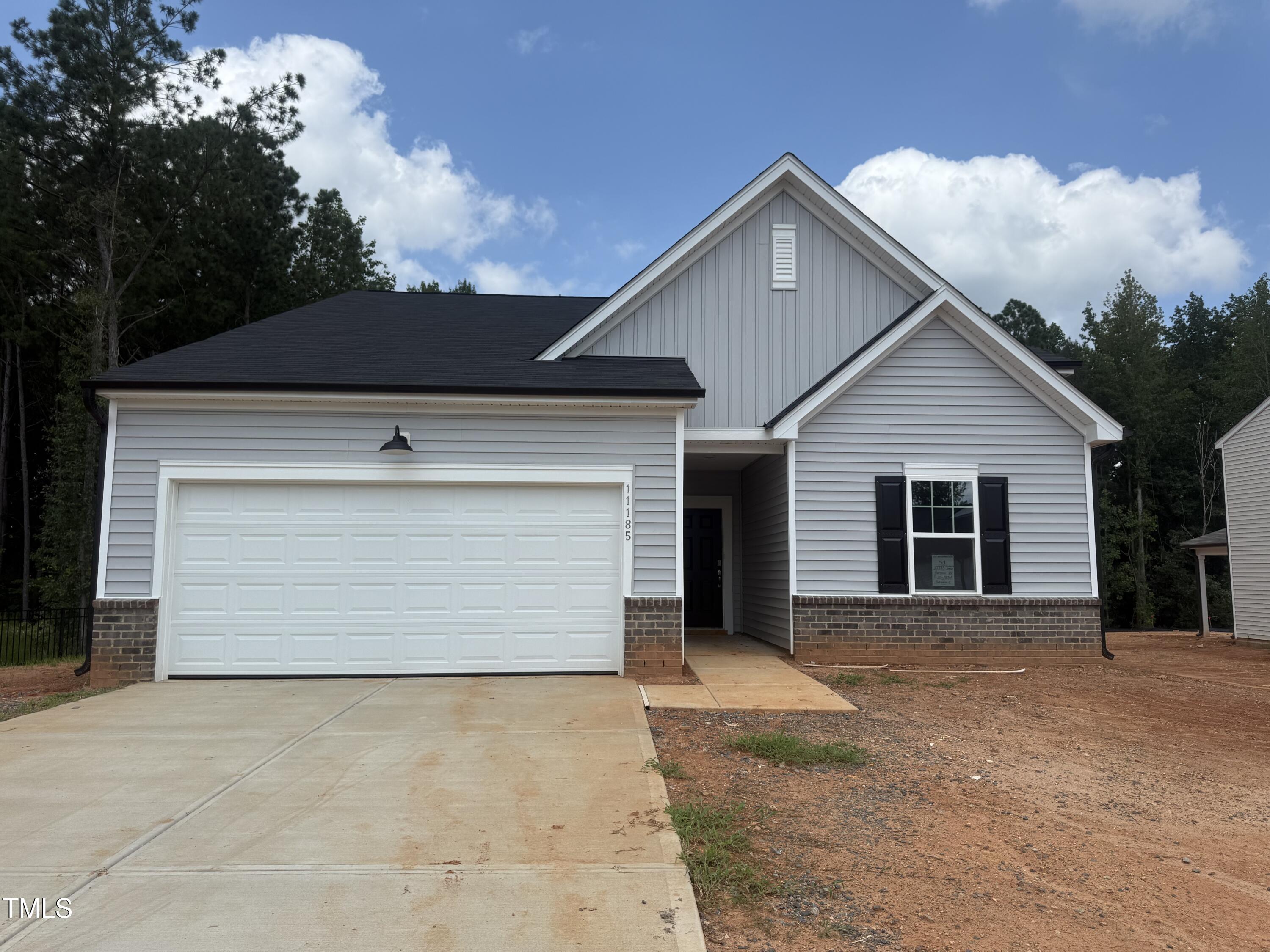 11185 Salers Loop Middlesex, NC 27557 - Photo 16 of 41 a front view of a house with a garage