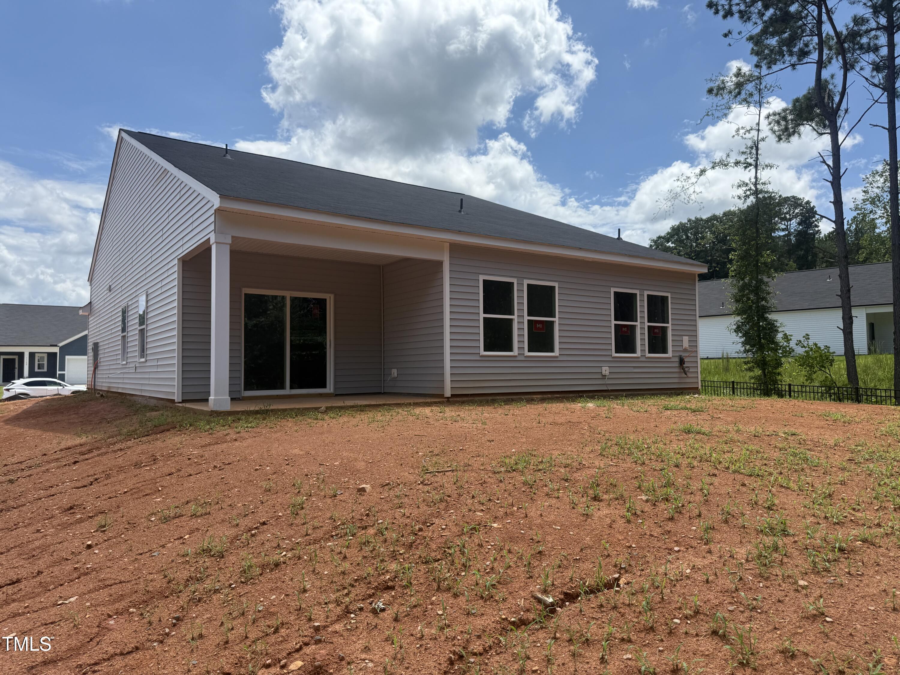 11185 Salers Loop Middlesex, NC 27557 - Photo 17 of 41 a backyard of a house with large trees