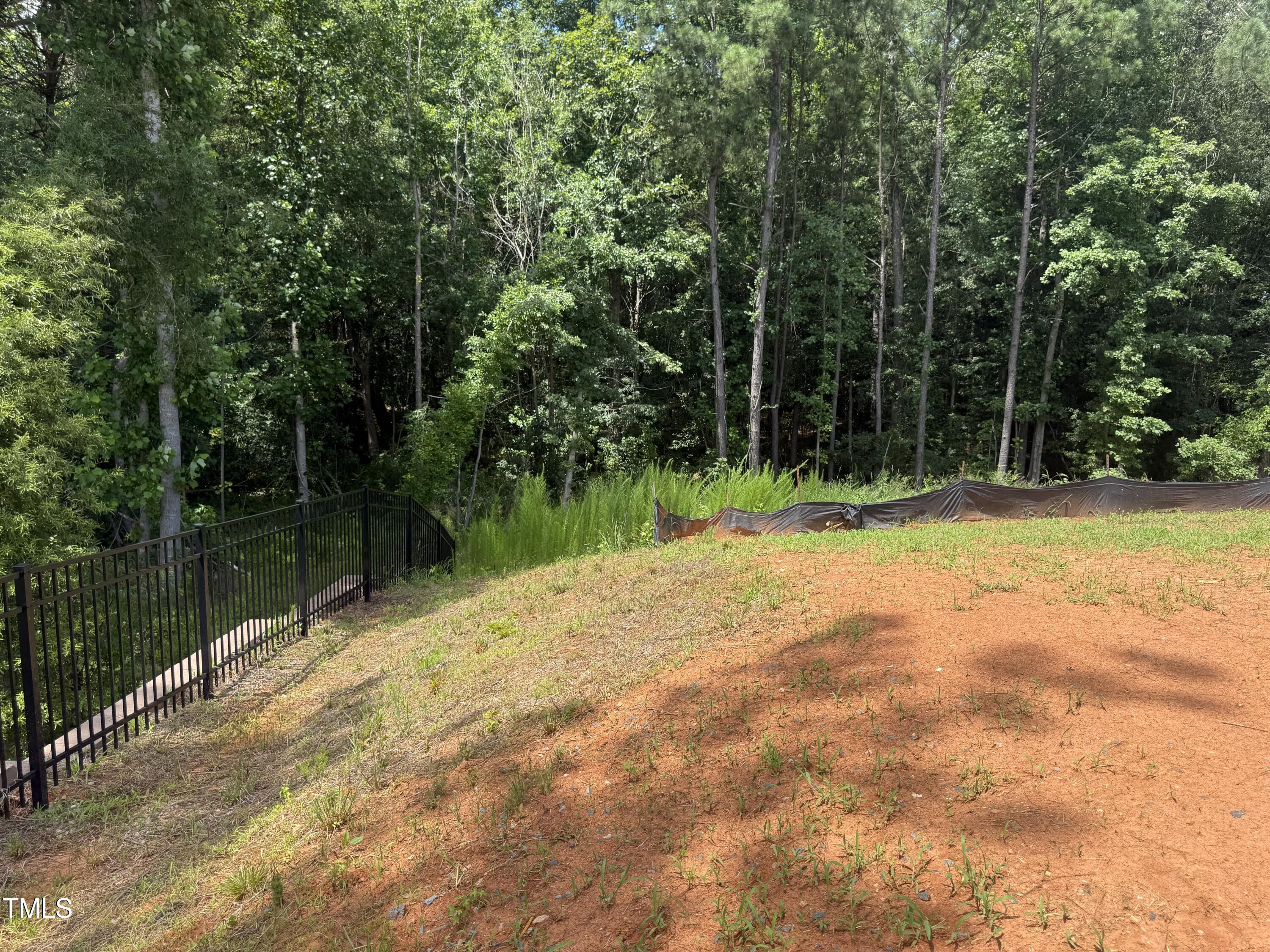 11185 Salers Loop Middlesex, NC 27557 - Photo 18 of 41 a wooden bench with lake view