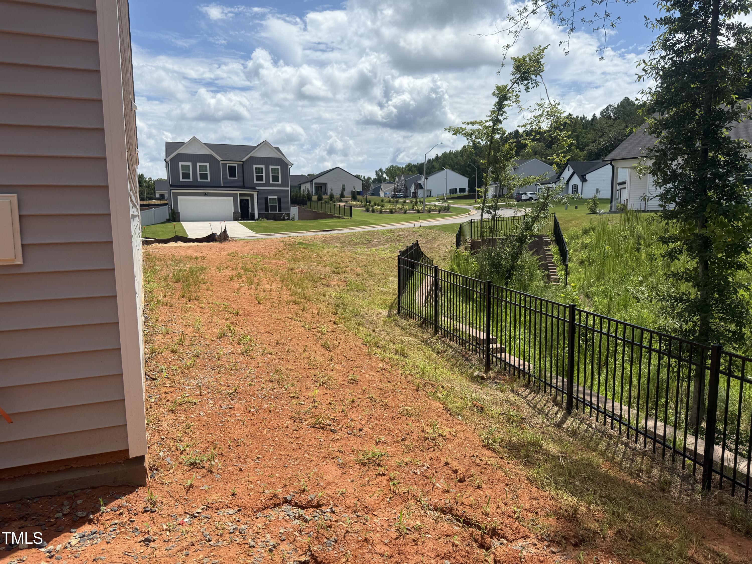 11185 Salers Loop Middlesex, NC 27557 - Photo 19 of 41 a view of a lake with a garden