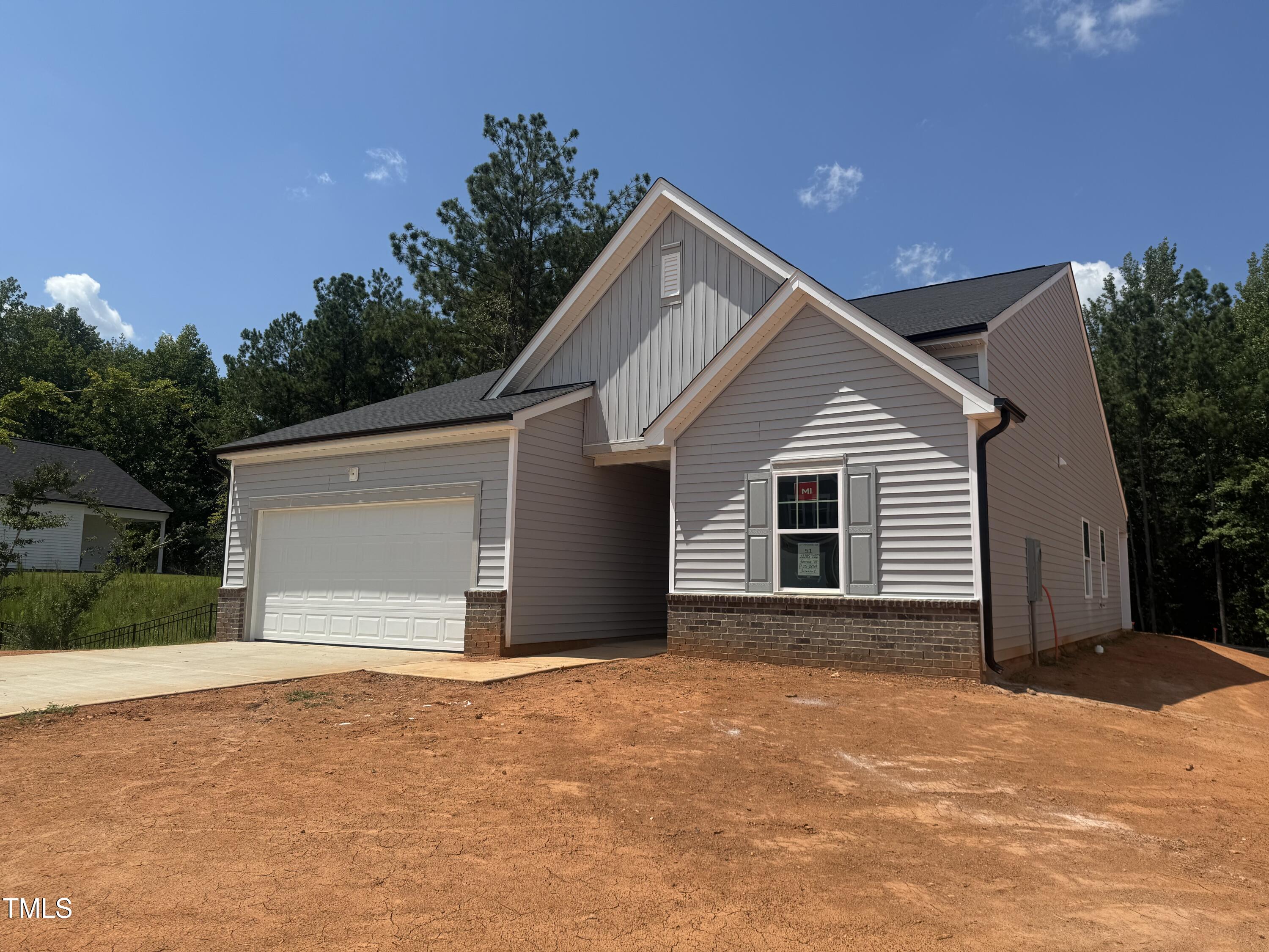 11185 Salers Loop Middlesex, NC 27557 - Photo 23 of 41 a front view of a house with a garage