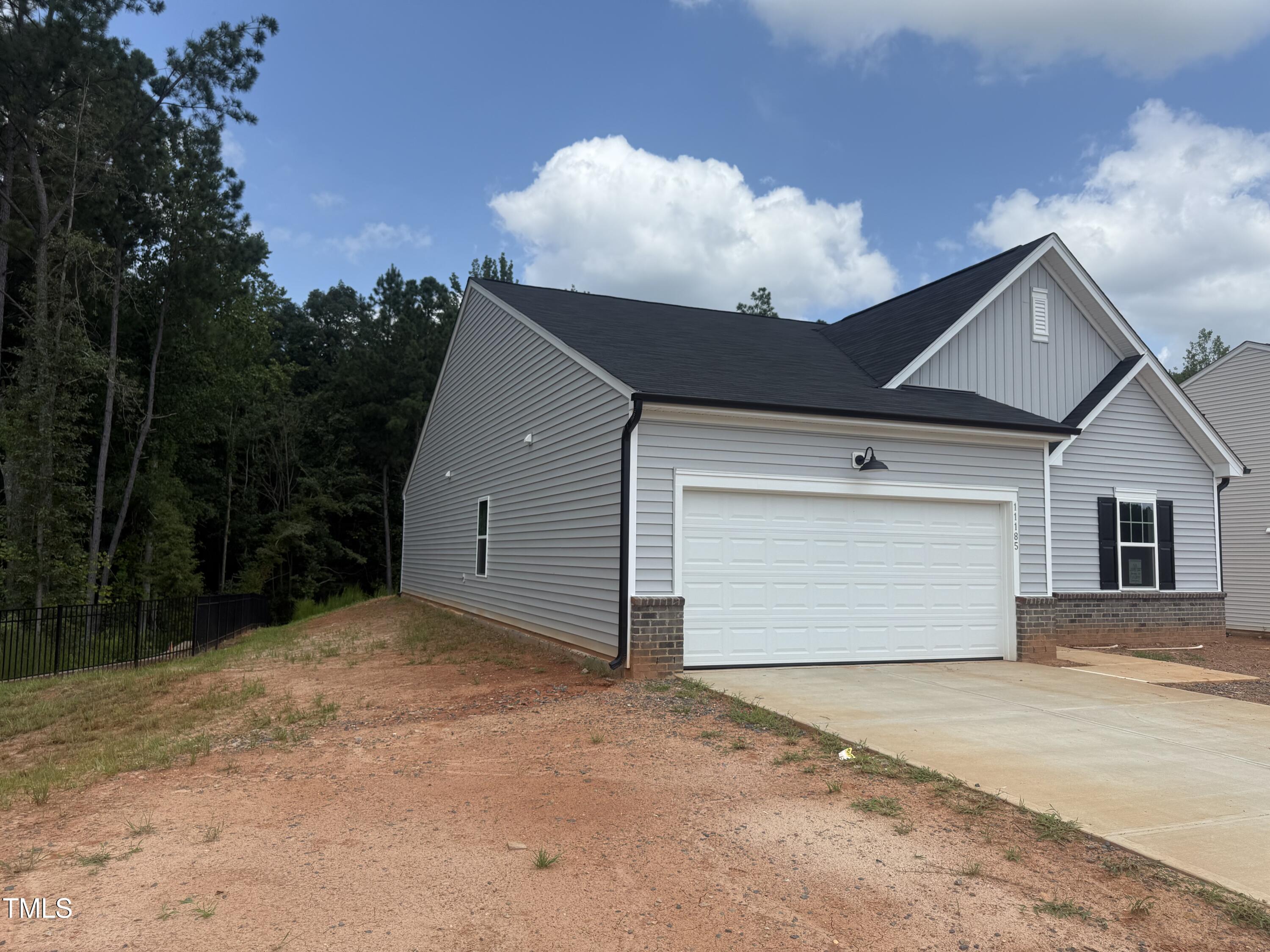 11185 Salers Loop Middlesex, NC 27557 - Photo 27 of 41 a front view of a house with a yard and garage