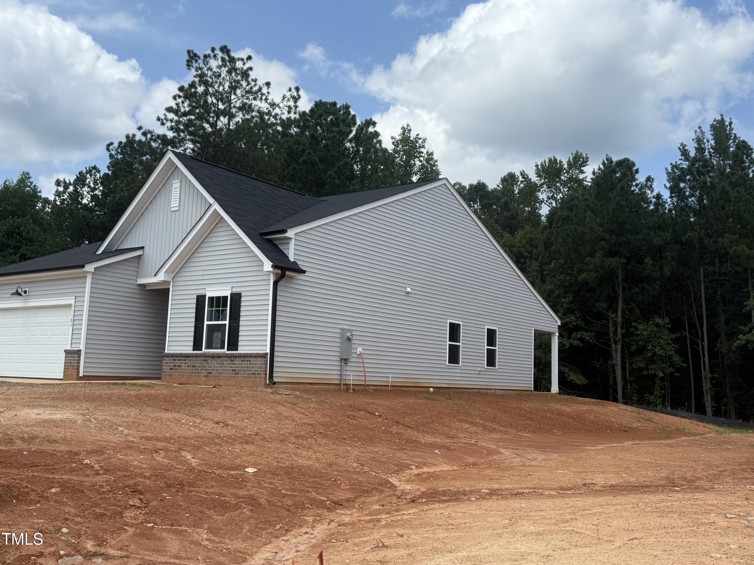 11185 Salers Loop Middlesex, NC 27557 - Photo 28 of 41 a view of a house with backyard and trees