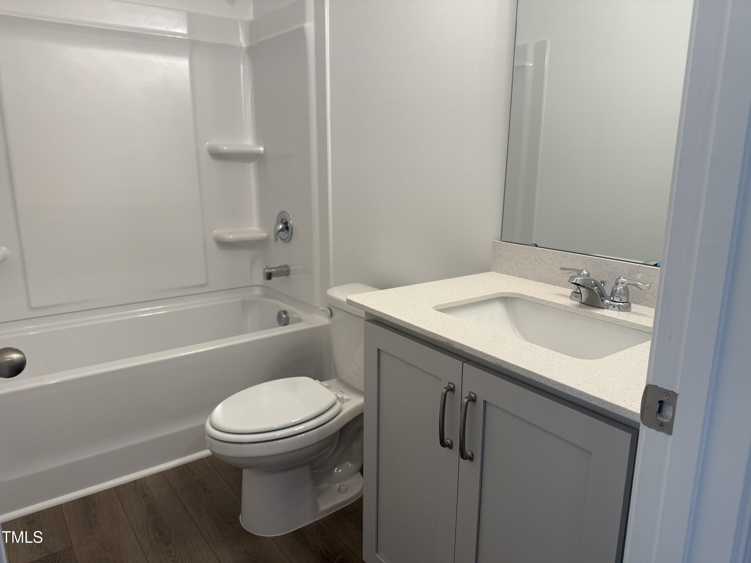 11185 Salers Loop Middlesex, NC 27557 - Photo 31 of 41 a bathroom with a sink toilet and shower