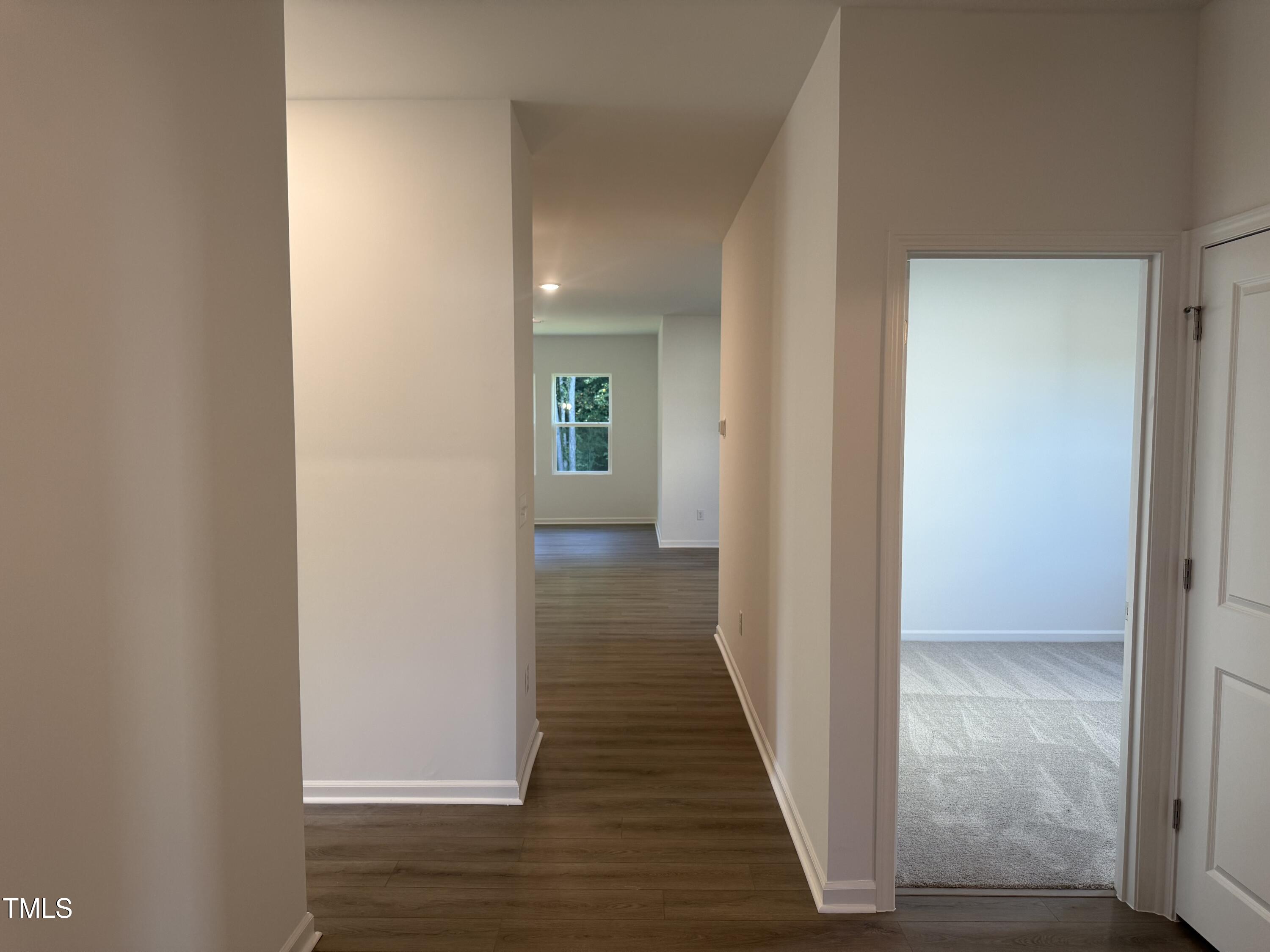 11185 Salers Loop Middlesex, NC 27557 - Photo 34 of 41 a view of a hallway with wooden floor