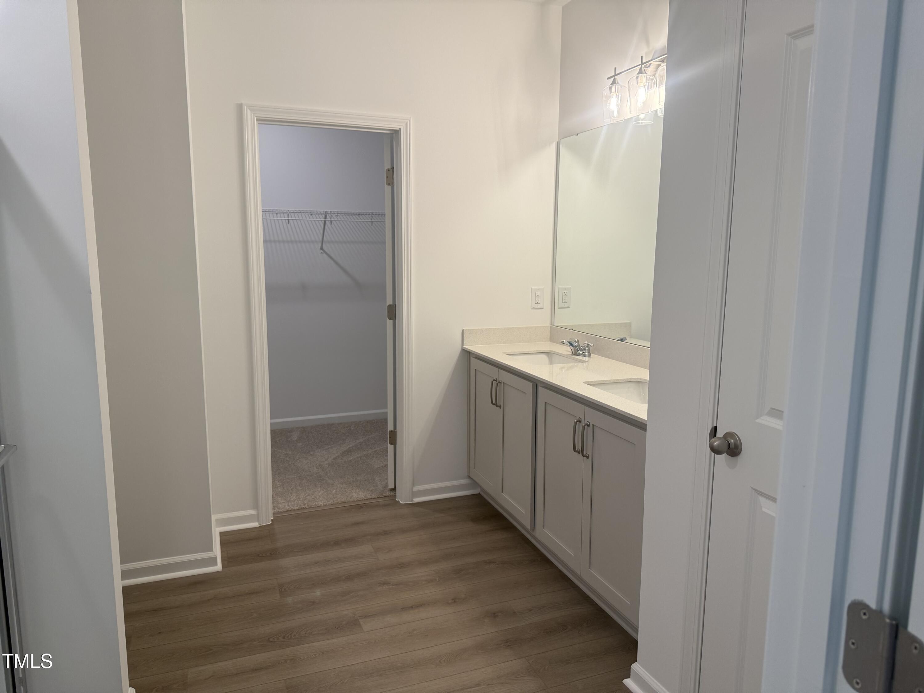 11185 Salers Loop Middlesex, NC 27557 - Photo 38 of 41 a spacious bathroom with a sink a mirror and a shower