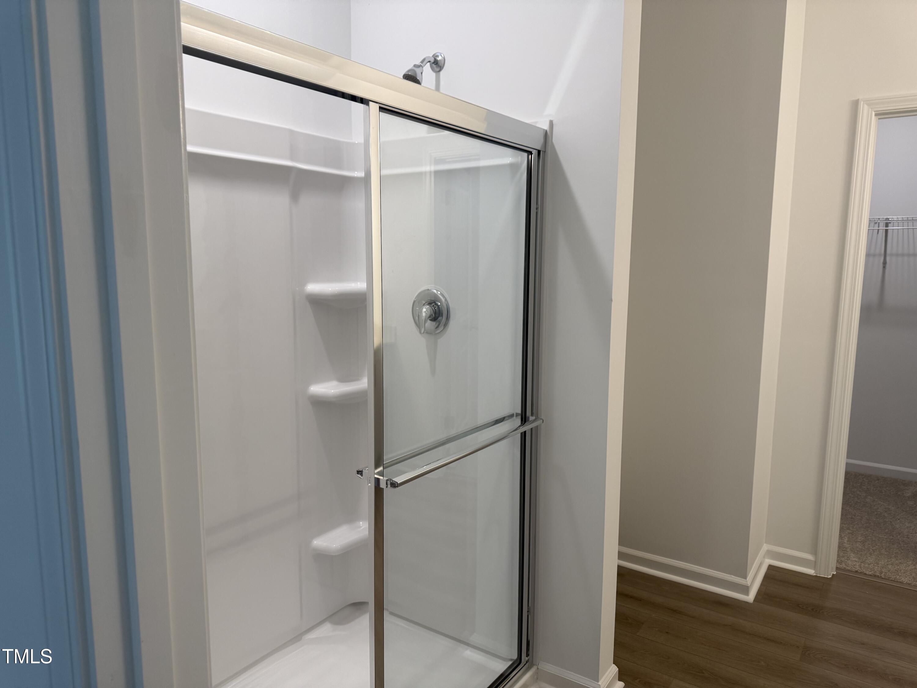 11185 Salers Loop Middlesex, NC 27557 - Photo 39 of 41 a bathroom with a glass shower door