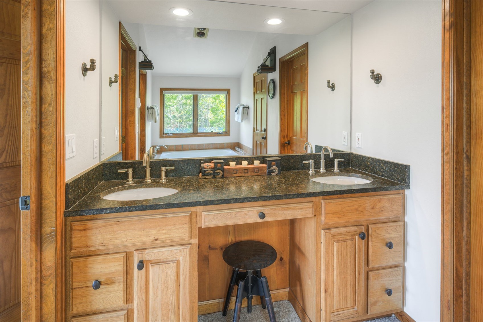 2542 Boreas Pass Road Breckenridge, CO 80424 - Photo 19 of 33 a bathroom with a granite countertop sink a toilet and a mirror
