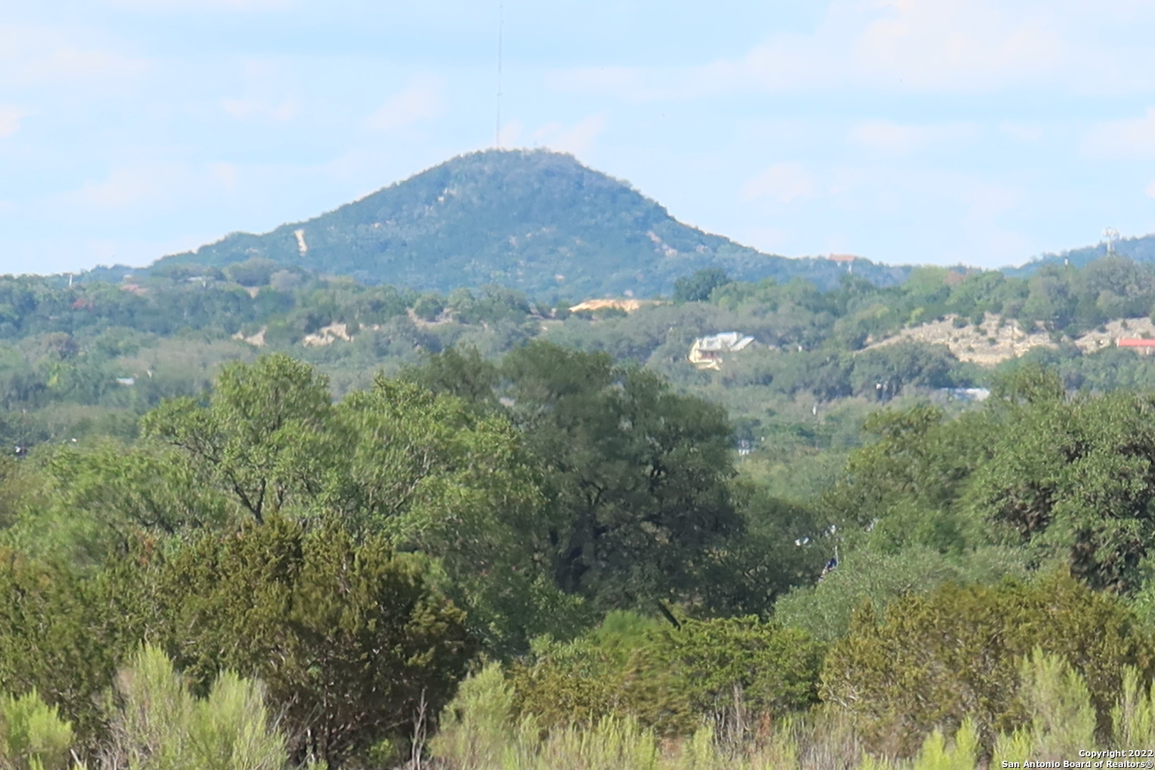 Tbd Little Sorrel Way Bandera, TX 78003 - Photo 1 of 12 a view of a mountain range with trees in the background