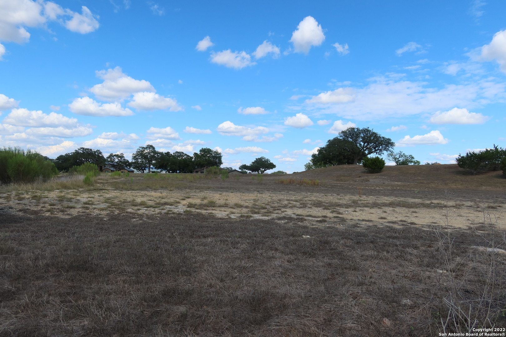 Tbd Little Sorrel Way Bandera, TX 78003 - Photo 4 of 12 a view of a lake with a yard
