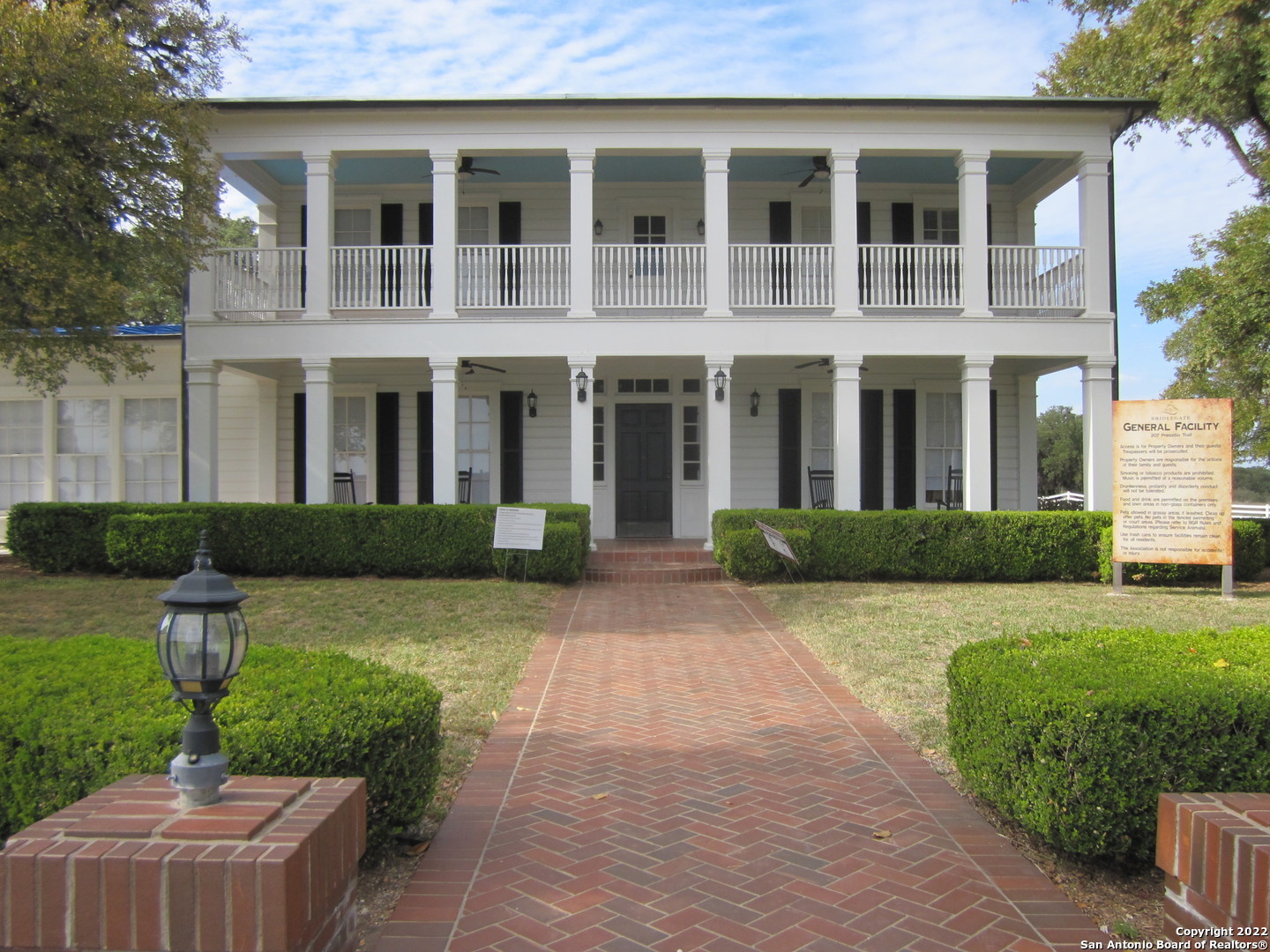 Tbd Little Sorrel Way Bandera, TX 78003 - Photo 9 of 12 a front view of a house with garden and porch