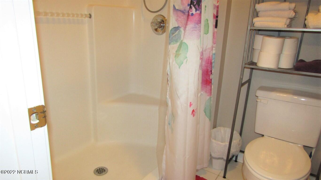 144 Rice Mill Circle, Unit 1 Sunset Beach, NC 28468 - Photo 23 of 36 Master Shower/Water C;oset