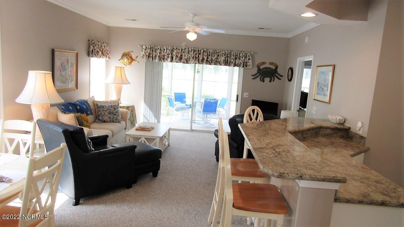 144 Rice Mill Circle, Unit 1 Sunset Beach, NC 28468 - Photo 3 of 36 Open Living/Dining/Kitchen