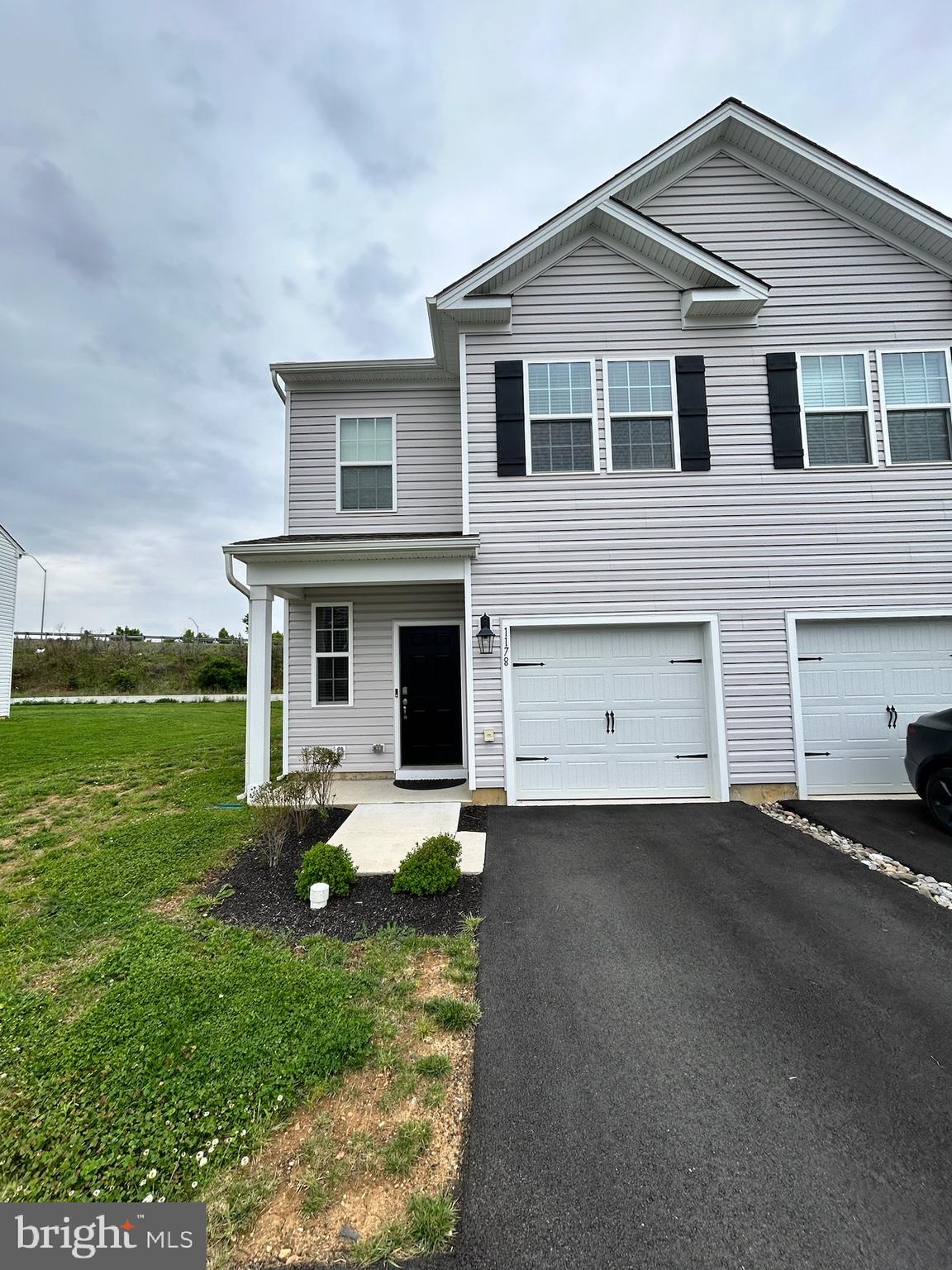 1178 Martin Road Breinigsville, PA 18031 - Photo 1 of 29 a front view of a house with a yard and garage