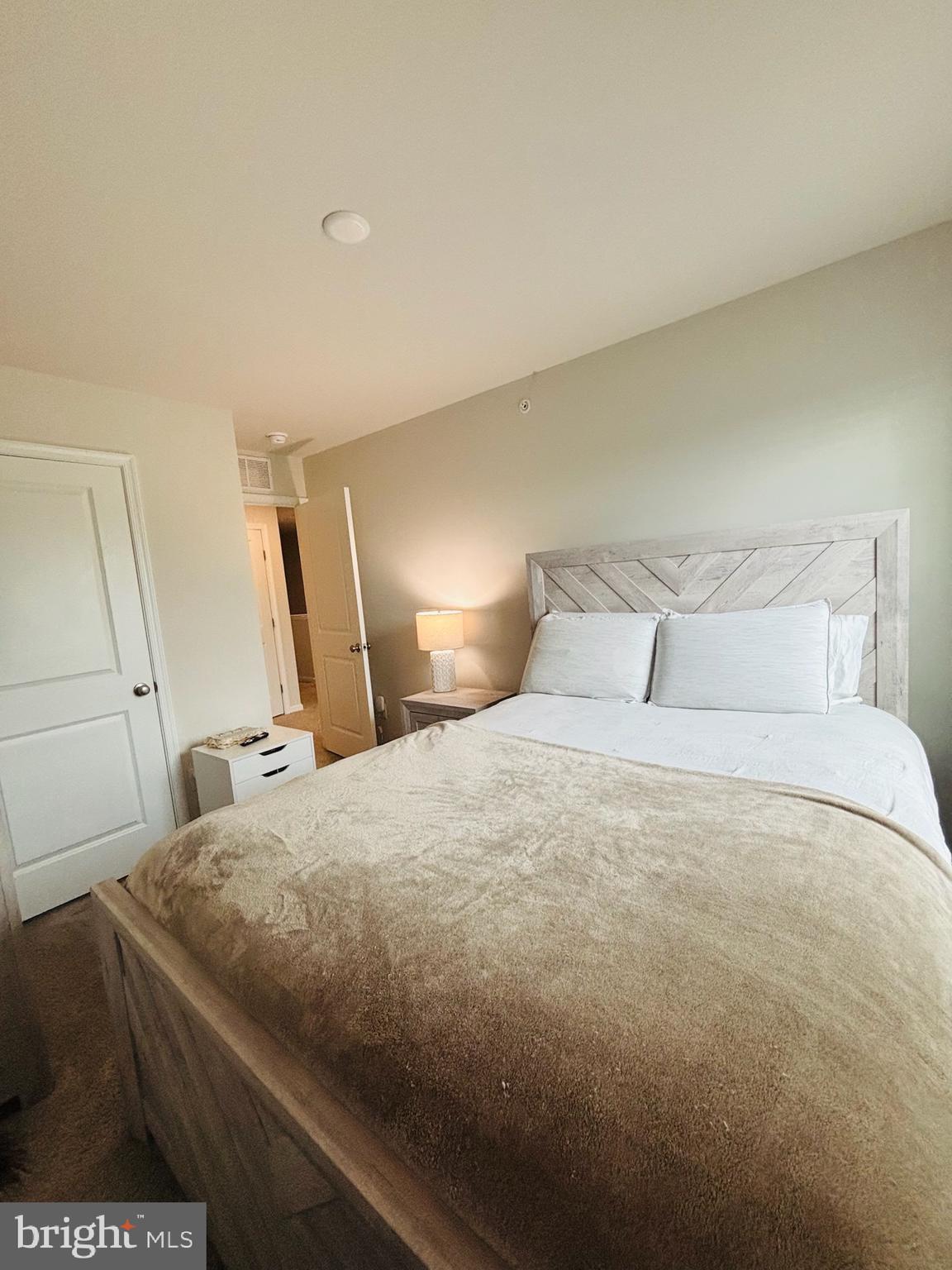 1178 Martin Road Breinigsville, PA 18031 - Photo 20 of 29 a bedroom with a bed and a flat tv screen on dresser