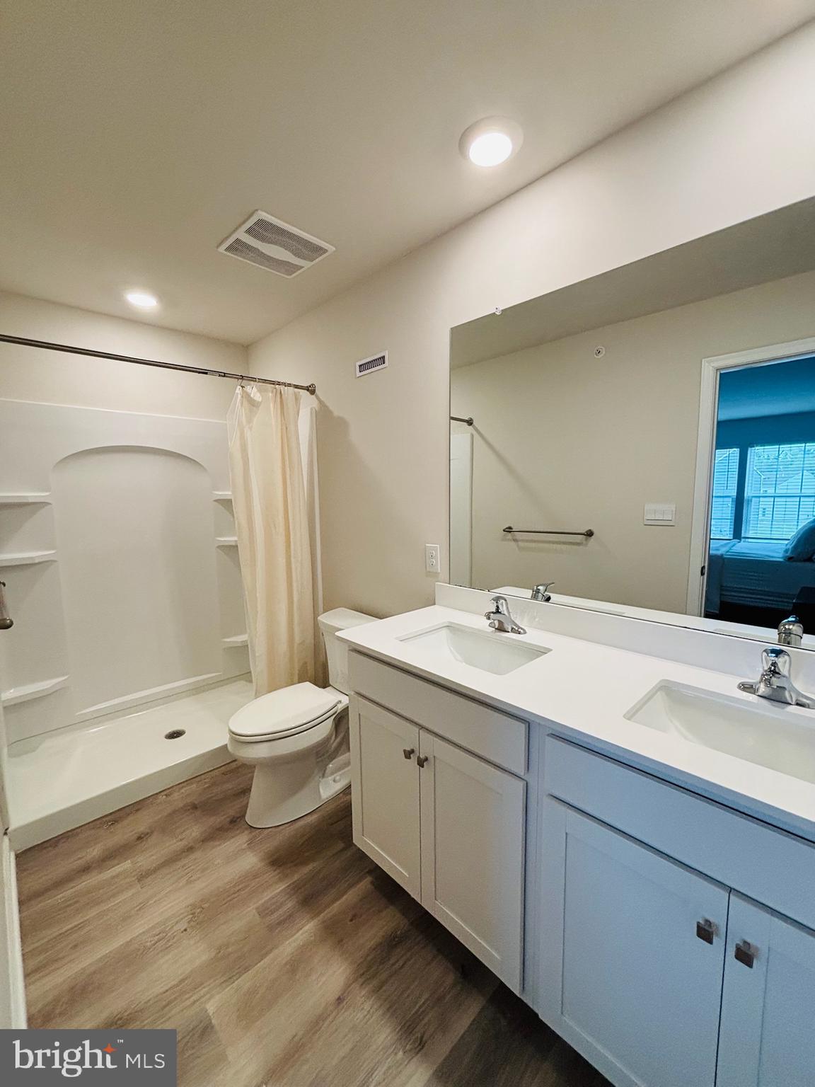 1178 Martin Road Breinigsville, PA 18031 - Photo 26 of 29 a bathroom with a double vanity sink toilet and shower