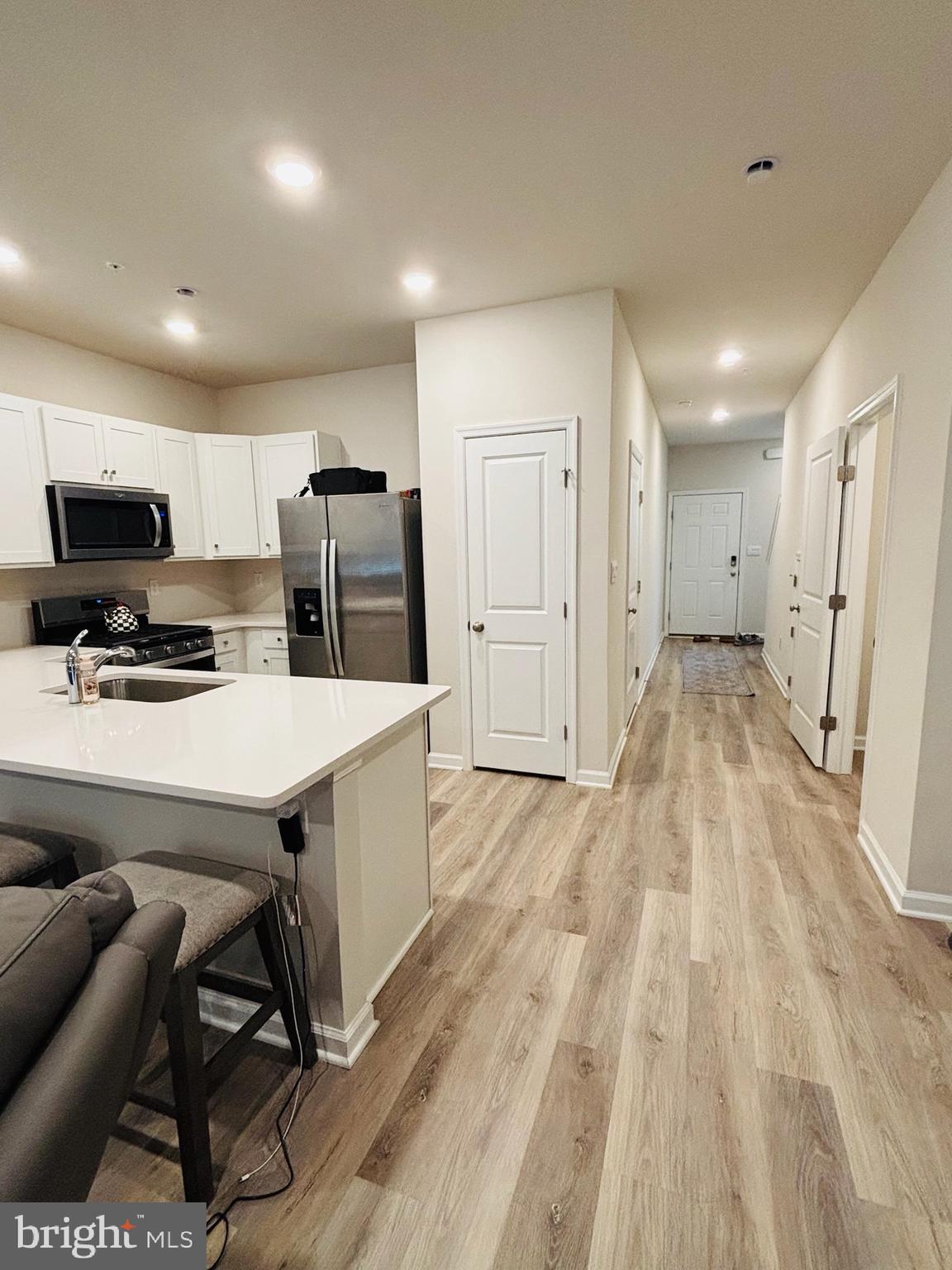 1178 Martin Road Breinigsville, PA 18031 - Photo 3 of 29 a kitchen with a table chairs refrigerator and microwave