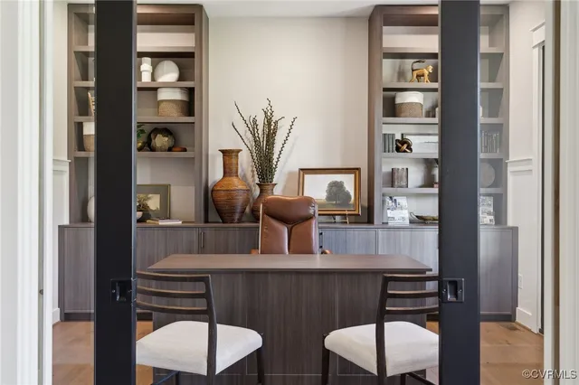 a dining room with furniture and wooden floor