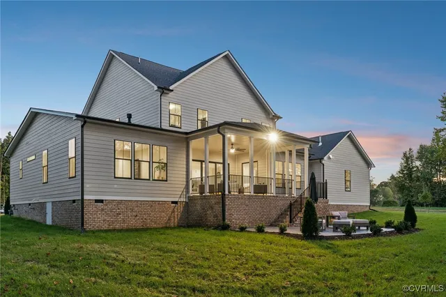 a front view of a house with swimming pool and porch