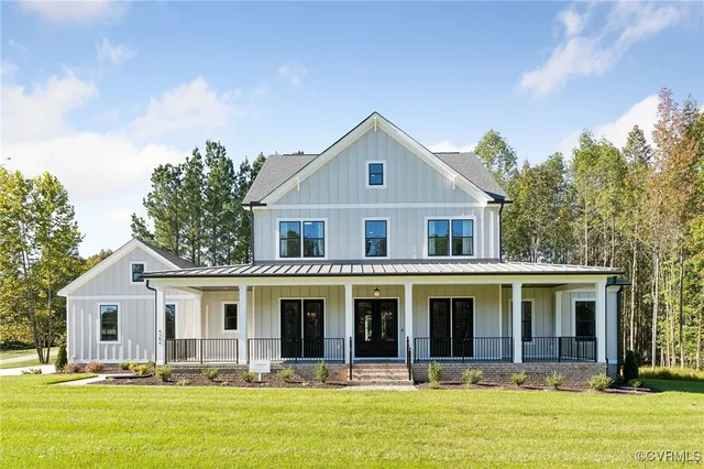 a front view of house with yard outdoor seating and barbeque oven