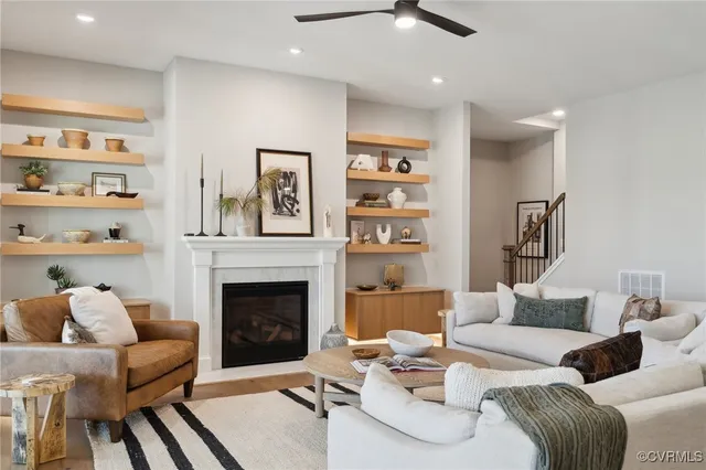 a living room with furniture and a fireplace