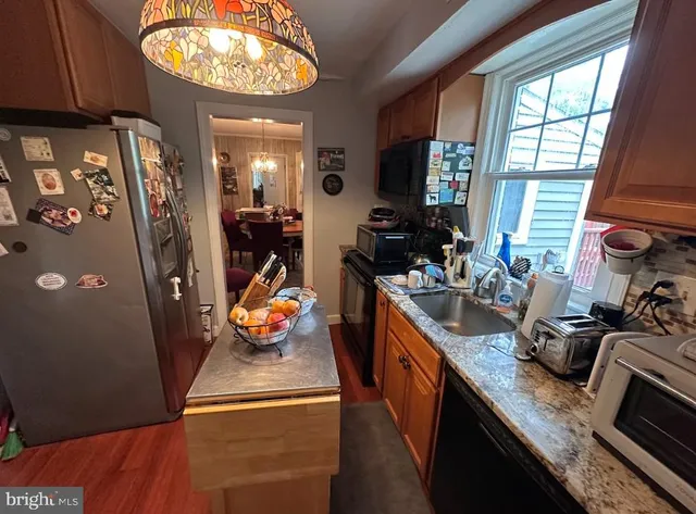 a kitchen with lots of counter top space and furniture