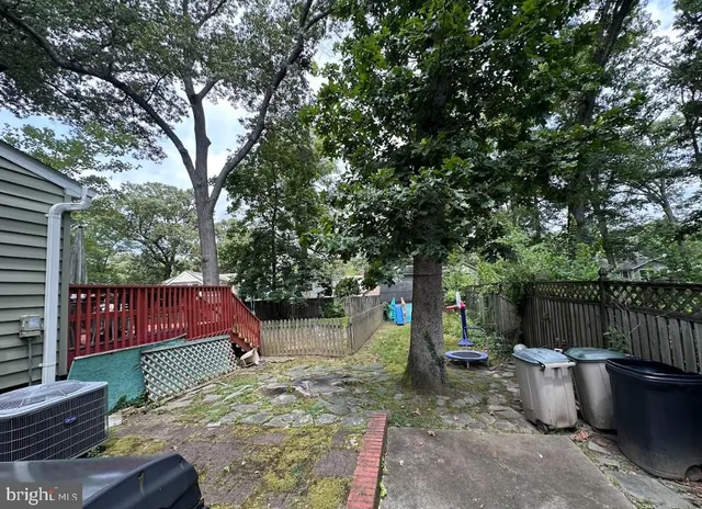 a backyard of a house with barbeque oven