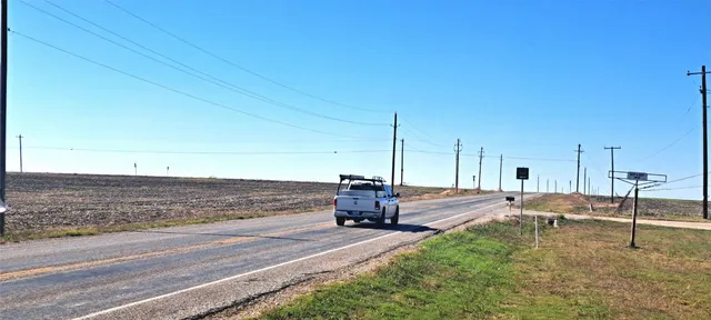 a view of a terrace with wooden fence