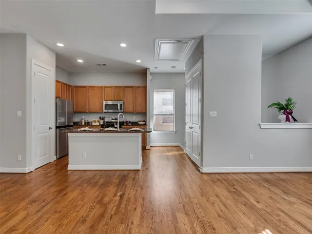 a view of kitchen with wooden floor