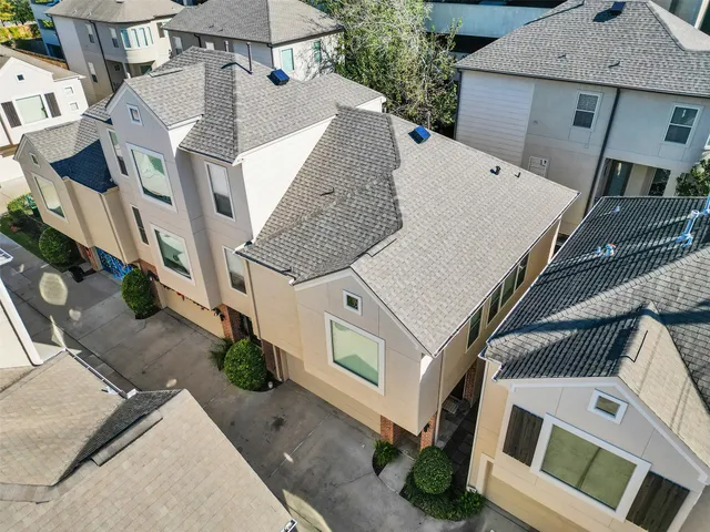 an aerial view of a house with outdoor space